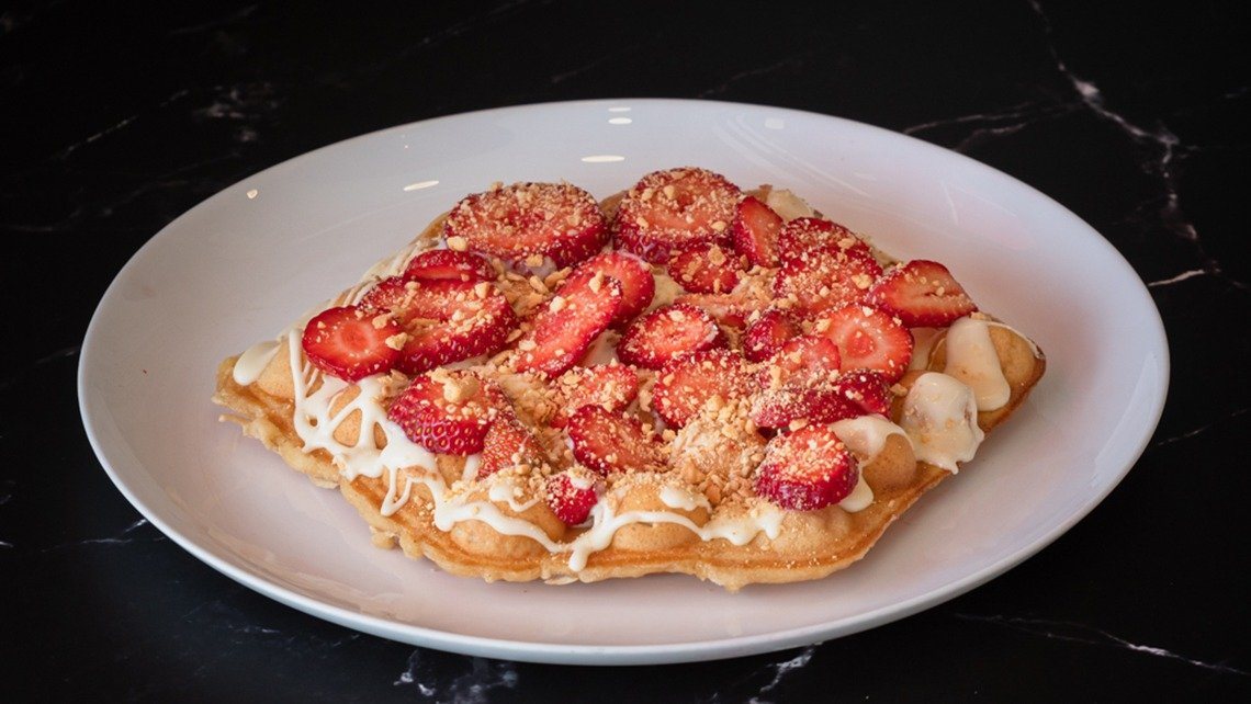 Fraoulenia waffle with white chocolate, strawberry and biscuit